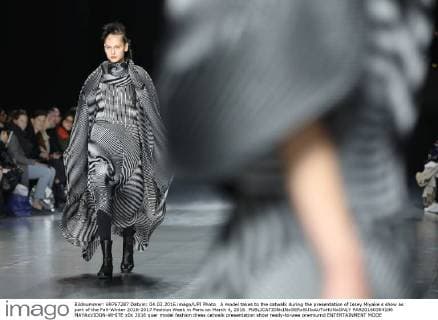 A model takes to the catwalk during the presentation of Issey Miyake s show as part of the Fall-Winter 2016-2017 Fashion Week in Paris on March 4, 2016.  PAR20160304106 MAYAxVIDON-WHITE