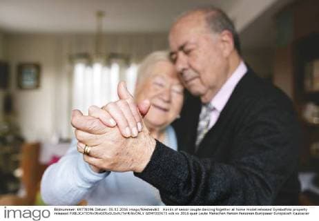 Hands of senior couple dancing together at home model released Symbolfoto property released  GEMF000675