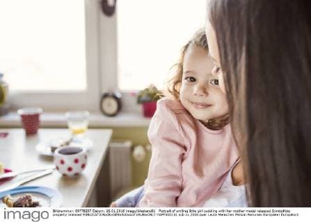 Portrait of smiling little girl cuddling with her mother model released Symbolfoto property released  HAPF000131