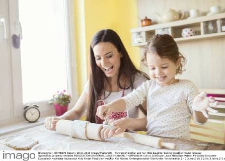 Portrait of mother and her little daughter baking together model released Symbolfoto property released  HAPF000144