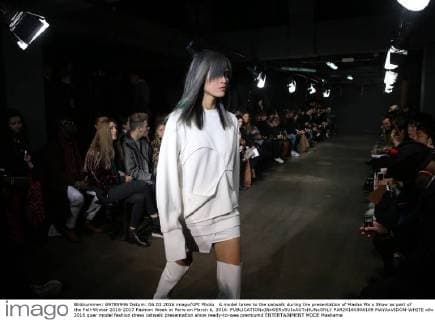 A model takes to the catwalk during the presentation of Masha Ma s Show as part of the Fall-Winter 2016-2017 Fashion Week in Paris on March 6, 2016.  PAR20160306109 MAYAxVIDON-WHITE