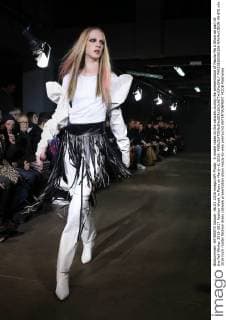 A model takes to the catwalk during the presentation of Masha Ma s Show as part of the Fall-Winter 2016-2017 Fashion Week in Paris on March 6, 2016.  PAR20160306106 MAYAxVIDON-WHITE
