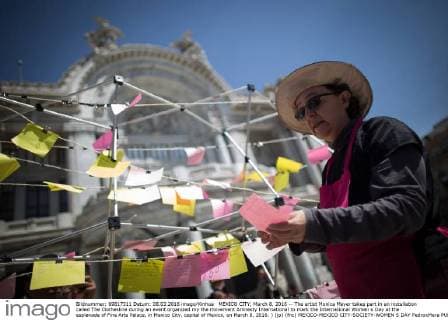 MEXICO CITY, March 8, 2016 -- The artist Monica Mayer takes part in an installation called The Clothesline during an event organized my the movement Amnesty International to mark the International Women s Day at the esplanade of Fine Arts Palace, in Mexico City, capital of Mexico, on March 8, 2016. ) (jp) (fnc) MEXICO-MEXICO CITY-SOCIETY-WOMEN S DAY PedroxMera 