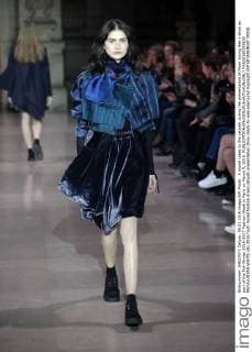A model takes to the catwalk during the presentation of Moon Young Hee s show as part of the Fall-Winter 2016-2017 Fashion Week in Paris on March 9, 2016.  PAR20160309103 MAYAxVIDON-WHITE