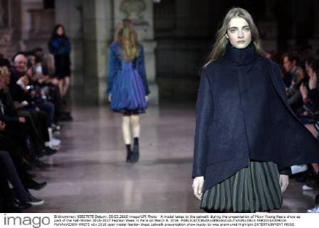 A model takes to the catwalk during the presentation of Moon Young Hee s show as part of the Fall-Winter 2016-2017 Fashion Week in Paris on March 9, 2016.  PAR20160309104 MAYAxVIDON-WHITE