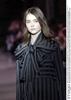 A model takes to the catwalk during the presentation of Moon Young Hee s show as part of the Fall-Winter 2016-2017 Fashion Week in Paris on March 9, 2016.  PAR20160309111 MAYAxVIDON-WHITE