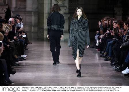 A model takes to the catwalk during the presentation of Moon Young Hee s show as part of the Fall-Winter 2016-2017 Fashion Week in Paris on March 9, 2016.  PAR20160309112 MAYAxVIDON-WHITE