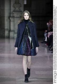 A model takes to the catwalk during the presentation of Moon Young Hee s show as part of the Fall-Winter 2016-2017 Fashion Week in Paris on March 9, 2016.  PAR20160309113 MAYAxVIDON-WHITE