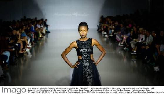 (160310) -- JOHANNESBURG, March 10, 2016 -- A model presents a creation by local designer Marianne Fassler on the opening day of Mercedes-Benz Fashion Week Joburg 2016 at Nelson Mandela Square in Johannesburg, South Africa on March 10, 2016. The Mercedes-Benz Fashion Week Joburg 2016, the largest and leading one in Africa, kicked off here Thursday. Creations by nearly 20 South African fashion designers are scheduled to be presented in 14 shows of the following three days. ) SOUTH AFRICA-JOHANNESBURG-FASHION WEEK ZhaixJianlan 