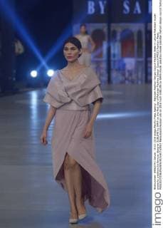 Pakistan Fashion Design Council Fashion Week in Lahore Pakistani model presents creations by famous designer SUBLIME by SARA on the first day of Pakistan Fashion Design Council (PFDC) Fashion Week.  RanaxSajidxHussain