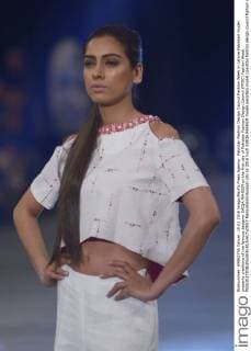 Pakistan Fashion Design Council Fashion Week in Lahore Pakistani model presents creations of the famous designer SAIQA RAHEEM on the first day of Pakistan Fashion Design Council (PFDC) Fashion Week.  RanaxSajidxHussain
