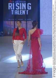 Pakistan Fashion Design Council Fashion Week in Lahore Pakistani model presents creations of the famous designer SAIQA RAHEEM on the first day of Pakistan Fashion Design Council (PFDC) Fashion Week.  RanaxSajidxHussain