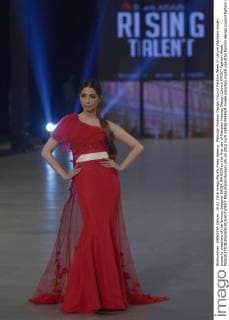 Pakistan Fashion Design Council Fashion Week in Lahore Pakistani model presents creations of the famous designer SAIQA RAHEEM on the first day of Pakistan Fashion Design Council (PFDC) Fashion Week.  RanaxSajidxHussain