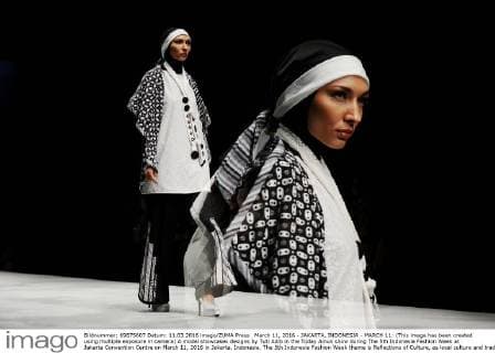 March 11, 2016 - JAKARTA, INDONESIA - MARCH 11: (This image has been created using multiple exposure in camera) A model showcases designs by Tuti Adib in the Today Ainun show during The 5th Indonesia Fashion Week at Jakarta Convention Centre on March 11, 2016 in Jakarta, Indonesia. The 5th Indonesia Fashion Week theme is Reflections of Culture, as local culture and tradition will be the basis and reference of the designs for Indonesia fashion design trend that would be able to carve Indonesia identity in the world of fashion that reflects its own culture. Indonesia hopes to become the Paris of Muslim fashion with modern designs in a variety of textures and colors. - ZUMAp112