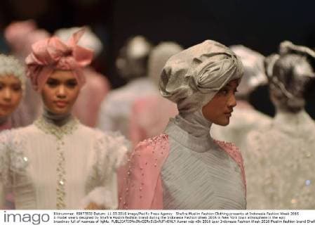 Shafira Muslim Fashion Clothing presents at Indonesia Fashion Week 2016 A model wears designed by Shafira Muslim fashion brand during the Indonesia Fashion Week 2016 in New York town atmosphere in the epic broadway full of nuances of lights.  Azwar