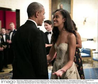 March 11, 2016 - Washington, DC, United States of America - U.S. President Barack Obama speaks with daughter Malia during a reception on the Truman Balcony before the State Dinner for Canadian Prime Minister Justin Trudeau at the White House March 10, 2016 in Washington, DC. This is the first state visit by a Canadian Prime Minister in 20-years. Washington United States of America - ZUMAp138