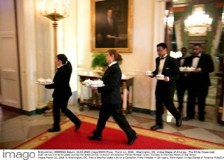 March 11, 2016 - Washington, DC, United States of America - The White House wait staff carries dinner to guest during the State Dinner in honor of Canadian Prime Minister Justin Trudeau in the East Room of the White House March 10, 2016 in Washington, DC. This is the first state visit by a Canadian Prime Minister in 20-years. Washington United States of America - ZUMAp138