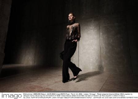 March 12, 2016 - Lisbon, Portugal - Model presents Autumn Winter 2016 creation by designer Carlos Gil during the 45rd edition of Moda Lisboa Fashion Week at the Patio da Gale on Terreiro do Paco Square in Lisbon on March 12, 2016. NURPHOTO CARLOS PALMA. Lisbon Portugal  - ZUMAn230