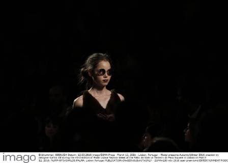 March 12, 2016 - Lisbon, Portugal - Model presents Autumn Winter 2016 creation by designer Carlos Gil during the 45rd edition of Moda Lisboa Fashion Week at the Patio da Gale on Terreiro do Paco Square in Lisbon on March 12, 2016. NURPHOTO CARLOS PALMA. Lisbon Portugal  - ZUMAn230