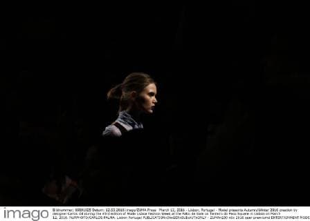 March 12, 2016 - Lisbon, Portugal - Model presents Autumn Winter 2016 creation by designer Carlos Gil during the 45rd edition of Moda Lisboa Fashion Week at the Patio da Gale on Terreiro do Paco Square in Lisbon on March 12, 2016. NURPHOTO CARLOS PALMA. Lisbon Portugal  - ZUMAn230