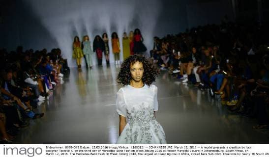 (160312) -- JOHANNESBURG, March 12, 2016 -- A model presents a creation by local designer Tsotetsi Kl on the third day of Mercedes-Benz Fashion Week Joburg 2016 at Nelson Mandela Square in Johannesburg, South Africa, on March 12, 2016. The Mercedes-Benz Fashion Week Joburg 2016, the largest and leading one in Africa, closed here Saturday. Creations by nearly 20 South African fashion designers have been presented in 14 shows of the past three days. ) SOUTH AFRICA-JOHANNESBURG-FASHION WEEK-CLOSING ZhaixJianlan 