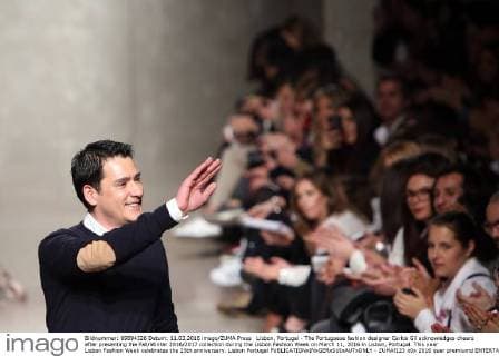 Lisbon, Portugal - The Portuguese fashion designer Carlos Gil acknowledges cheers after presenting the Fall Winter 2016 2017 collection during the Lisbon Fashion Week on March 11, 2016 in Lisbon, Portugal. This year Lisbon Fashion Week celebrates the 25th anniversary. Lisbon Portugal - ZUMAf123