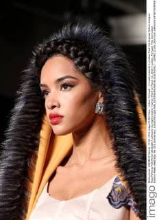 Lisbon, Portugal - A model presents a creation from the Angolan fashion designer Rose Palhares Fall Winter 2016 2017 collection during the Lisbon Fashion Week on March 11, 2016 in Lisbon, Portugal. This year Lisbon Fashion Week celebrates the 25th anniversary. Lisbon Portugal - ZUMAf123