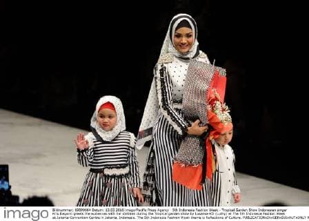 5th Indonesia Fashion Week - Tropical Garden Show Indonesian singer Kris Dayanti greets the audiences with her children during the Tropical garden show by Lusense KD (Luthy) at The 5th Indonesia Fashion Week at Jakarta Convention Centre in Jakarta, Indonesia. The 5th Indonesia Fashion Week theme is Reflections of Culture.  RobertusxPudyanto