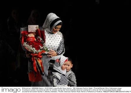 5th Indonesia Fashion Week - Tropical Garden Show Indonesian singer Kris Dayanti greets the audiences with her children during the Tropical garden show by Lusense KD (Luthy) at The 5th Indonesia Fashion Week at Jakarta Convention Centre in Jakarta, Indonesia. The 5th Indonesia Fashion Week theme is Reflections of Culture.  RobertusxPudyanto