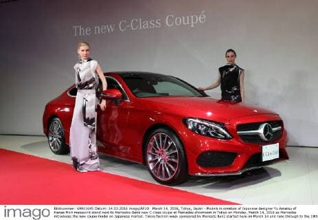 March 14, 2016, Tokyo, Japan - Models in creation of Japanese designer Yu Amatsu of Hanae Mori manuscrit stand next to Mercedes-Benz new C-class coupe at Mercedes showroom in Tokyo on Monday, March 14, 2016 as Mercedes introduces the new coupe model on Japanese market. Tokyo fashion week sponsored by Merceds Benz started here on March 14 and runs through to the 19th.  (lwxa000282)