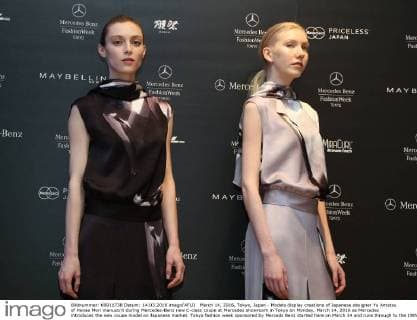 March 14, 2016, Tokyo, Japan - Models display creations of Japanese designer Yu Amatsu of Hanae Mori manuscrit during Mercedes-Benz new C-class coupe at Mercedes showroom in Tokyo on Monday, March 14, 2016 as Mercedes introduces the new coupe model on Japanese market. Tokyo fashion week sponsored by Merceds Benz started here on March 14 and runs through to the 19th.  (lwxa000277)