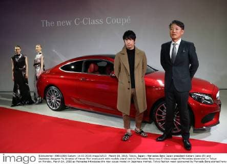 March 14, 2016, Tokyo, Japan - Mercedes Benz Japan president Kintaro Ueno (R) and Japanese designer Yu Amatsu of Hanae Mori manuscrit with models stand next to Mercedes-Benz new C-class coupe at Mercedes showroom in Tokyo on Monday, March 14, 2016 as Mercedes introduces the new coupe model on Japanese market. Tokyo fashion week sponsored by Merceds Benz started here on March 14 and runs through to the 19th.  (lwxa000288)