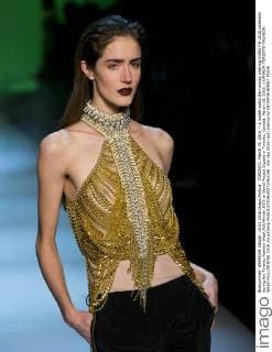 TORONTO, March 15, 2016 -- A model walks the runway wearing Unttld FW 2016 collection during the Toronto Fashion Week Fall Winter 2016 at David Pecaut Square in Toronto, Canada, March 15, 2016. ) CANADA-TORONTO-FASHION WEEK-FALL WINTER 2016 ZouxZheng 