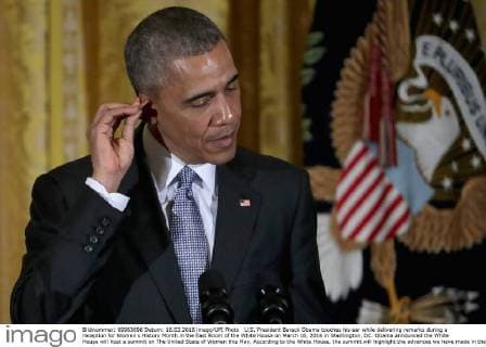 U.S. President Barack Obama touches his ear while delivering remarks during a reception for Women s History Month in the East Room of the White House on March 16, 2016 in Washington, DC. Obama announced the White House will host a summit on The United State of Women this May. According to the White House, the summit will highlight the advances we have made in the United States and across the globe and to expand our efforts on helping women confront the challenges they face and reach for their highest aspirations. Pool photo by Chip Somodevilla  WAX20160316202 CHIPxSOMODEVILLA
