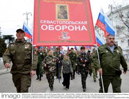 SEVASTOPOL, RUSSIA. MARCH 18, 2016. Members of the Sevastopolskaya Oborona Defence of Sevastopol organisation take part in a solemn procession in Sevastopol, the largest city in Crimea, celebrating the second anniversary of Crimea s reunification with Russia. 96% of Crimeans voted for reunification with Russia in the 2014 Crimean referendum. Alexander Karpushkin TASS  TS019D6B