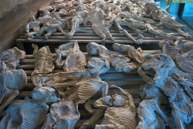 February 5, 2016 - Murambi, Nyamagabe, Rwanda - In 1995, the remains of more than 18,000 men, women and children were exhumed from mass graves at the Murambi Technical School, now known as the Murambi Genocide Memorial Centre in southern Rwanda. Although many bodies decomposed completely, the intense heat formed in the pits allowed some of the skeletal remains to be preserved. Most of these corpses were reburied in in common graves at the memorial centre. However, nearly one thousand corpses were further preserved in lime and placed in the school buildings where they were killed; these are the remains of children. Murambi Rwanda - ZUMAf76_