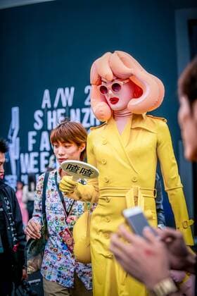 SHENZHEN, CHINA - MARCH 20: (CHINA OUT) Pandemonia, the creation of a conceptual artist, is seen during the Shenzhen Fashion Week Fall Winter 2016 on March 20, 2016 in Shenzhen, Guangdong Province of China. Pandemonia is the creation of a very secretive, self-styled conceptual artist, and has gone from Fashion Week party crasher to VIP guest in three seasons. Currently she caused a stir on the front row of all the best shows at Fashion Week.  CFP481495620