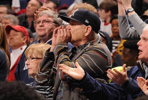 Actor Bill Murray cheers on Xavier from behind their bench as they play Wisconsin in the NCAA Division 1 Men s Basketball Championship at the Scottrade Center in St. Louis on March 20, 2016. Murray s son Luke is an assistant coach with the team. Wisconsin defeated Xavier, 66-63.  SLP2016032014