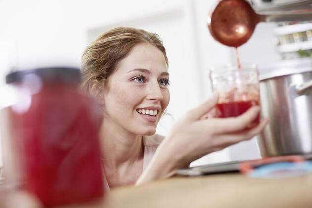 Filling jam into jars model released Symbolfoto property released  FMKF002408
