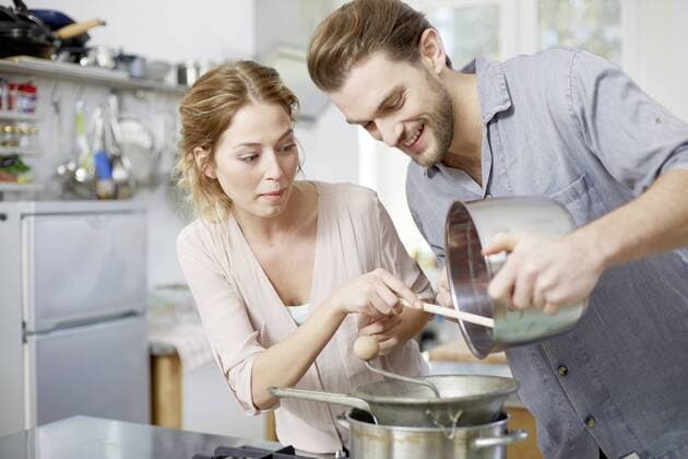 Couple cooking in kitchen together model released Symbolfoto property released  FMKF002391