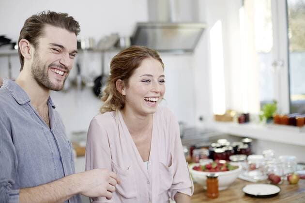 Happy couple in kitchen model released Symbolfoto property released  FMKF002366