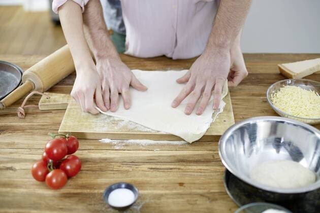 Couple preparing dough together model released Symbolfoto property released  FMKF002394