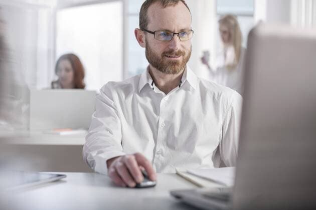 Man using laptop in office model released Symbolfoto property released  ZEF008470