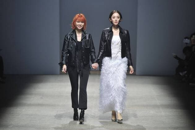 BEIJING, CHINA - MARCH 24: (CHINA OUT) Fashion designer Zhao Tao (L), actress and model Gulnazar showcase on runway during the 2016 Alexander.T.Zhao Collection Autumn Winter on March 24, 2016 in Beijing, China.  CFP481674657