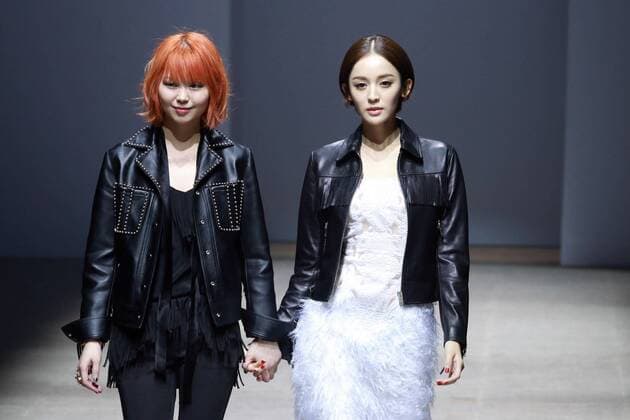 BEIJING, CHINA - MARCH 24: (CHINA OUT) Fashion designer Zhao Tao (L), actress and model Gulnazar showcase on runway during the 2016 Alexander.T.Zhao Collection Autumn Winter on March 24, 2016 in Beijing, China.  CFP481674660