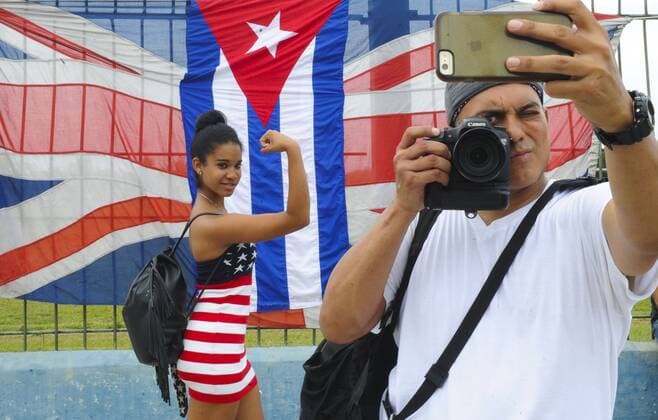 (160326) -- HAVANA, March 26, 2016 -- Residents pose near the Sports City ahead of the free concert of British band The Rolling Stones, in Havana, Cuba, on March 25, 2016. Over half a million people are expected Friday at the Rolling Stones first ever concert in Cuba, a landmark cultural event that comes just three days after U.S. President Barack Obama visited the Caribbean nation. Paula Ribas ) CUBA-HAVANA-MUSIC-THE ROLLING STONES TELAM 