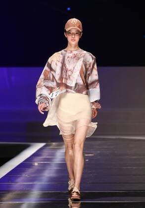BEIJING, CHINA - MARCH 25: (CHINA OUT) A model showcases designs on the runway at Hempel Award - the 24th China International Young Fashion Designers Contest during day one of the Mercedes-Benz China Fashion Week A W 16 17 Collection at Beijing Hotel on March 25, 2016 in Beijing, China.  CFP481722777