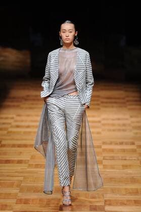 BEIJING, CHINA - MARCH 26: (CHINA OUT) A model showcases designs on the runway at Asahi Kasei Chinese Fashion Designer Creativity Award - Liu Sicong Collection during the Mercedes-Benz China Fashion Week Autumn Winter 2016 2017 at Beijing Hotel on March 26, 2016 in Beijing, China.  CFP481757744