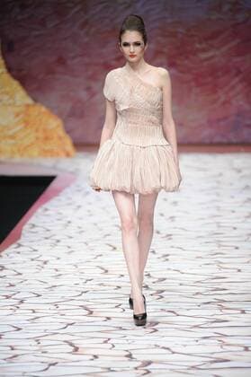BEIJING, CHINA - MARCH 27: (CHINA OUT) A model showcases designs on the runway at Tao LouLan Collection during the Mercedes-Benz China Fashion Week Autumn Winter 2016 2017 at 751D.Park on March 27, 2016 in Beijing, China.  CFP481794471