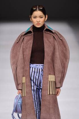 BEIJING, CHINA - MARCH 29: (CHINA OUT) A model showcases designs on the runway at Beijing Institute of Fashion Technology¡¤Emerging Design Collection & BIFT¡¤ELLASSAY Scholarship Awarding Ceremony during the Mercedes-Benz China Fashion Week Autumn Winter 2016 2017 at Beijing Hotel on March 29, 2016 in Beijing, China.  CFP481872732